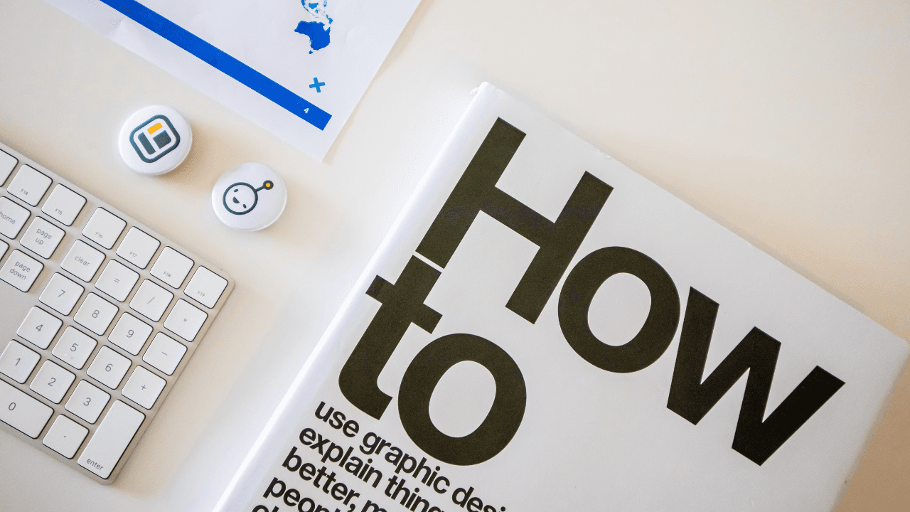 Graphic design book beside a keyboard